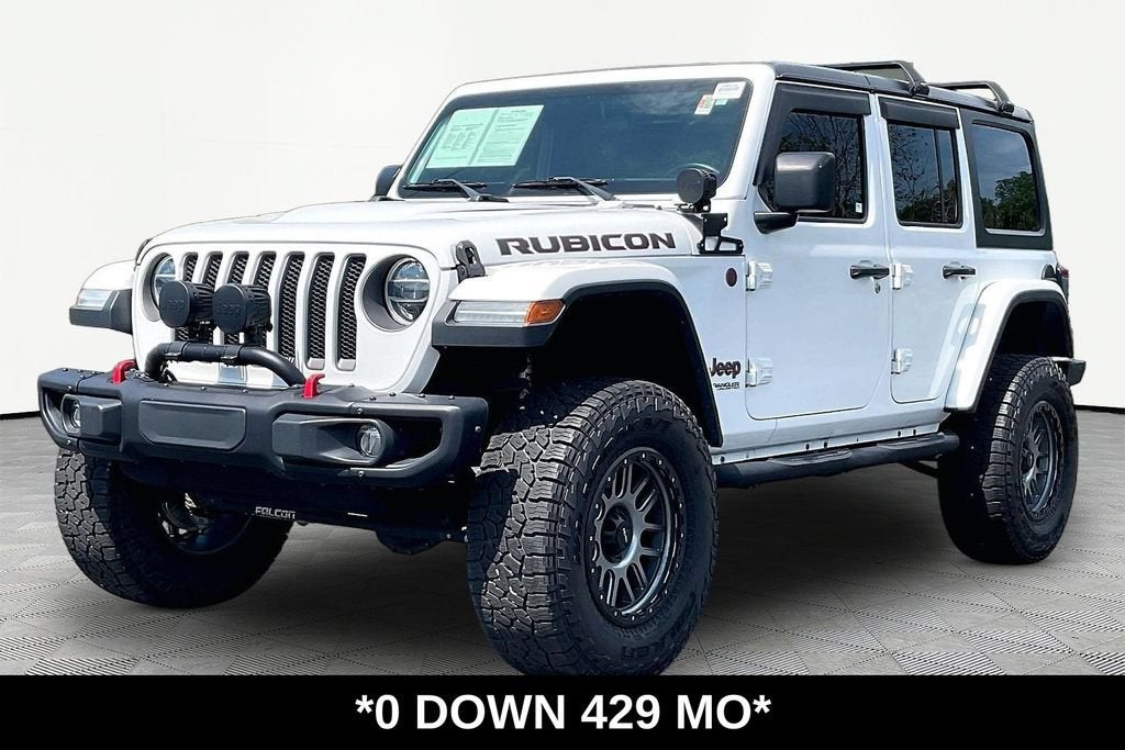 2019 Jeep Wrangler Unlimited Rubicon in Bright White Clea — front three-quarter view